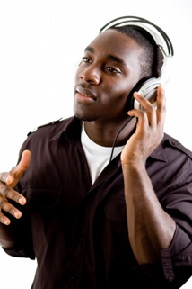 This is an image of a student listenning to music using headphones.